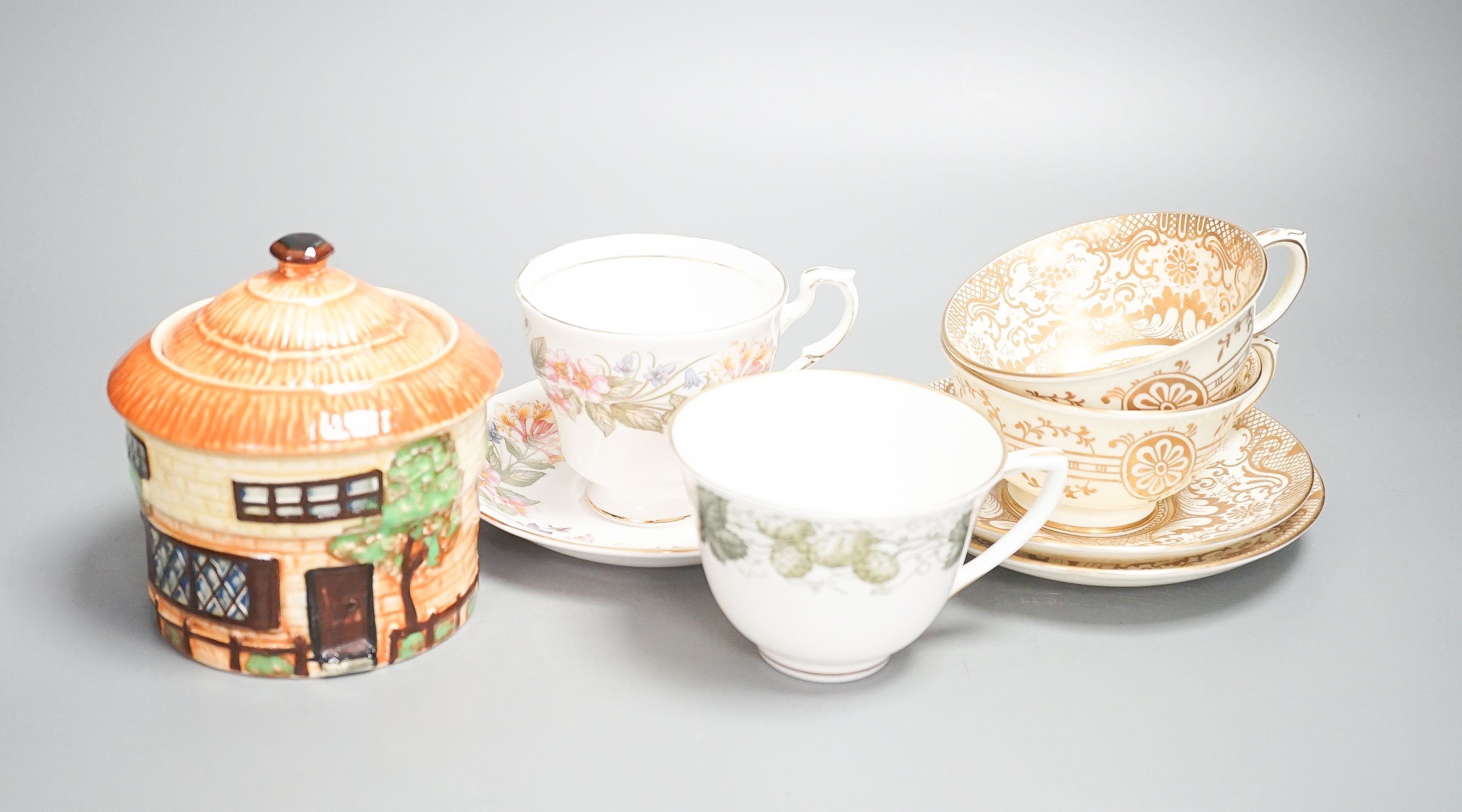 A Crown Staffordshire fifty nine piece part tea set and dessert service, central flowers and gilt borders